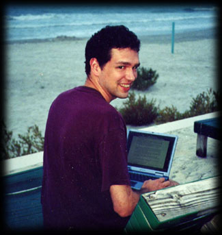 John sits atop the sea wall while he works on a chapter of the Worlds Saga
